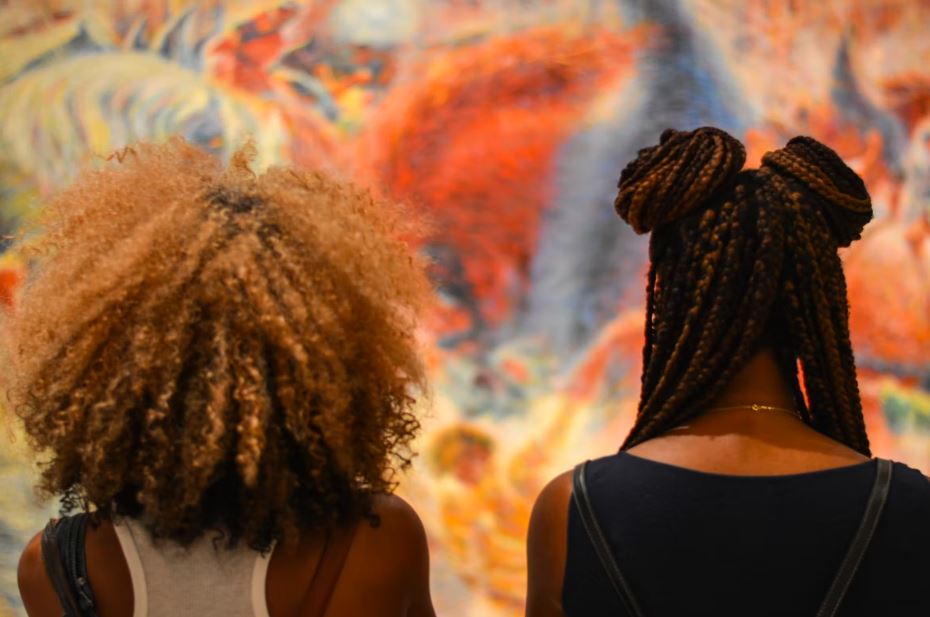 two women admiring art