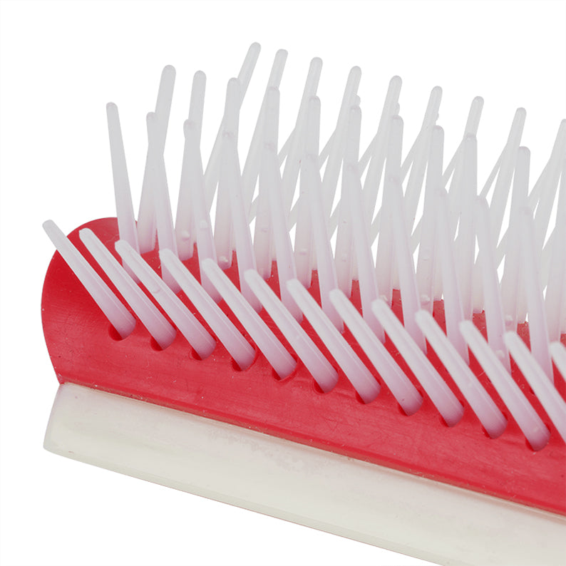ANNIE rubber cushion detangling brush close up showing red rubber base and white flexible bristles