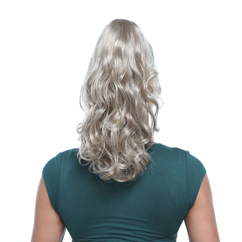 Back view of ash blonde wavy drawstring ponytail with claw clip attached for added volume from HAIR COUTURE