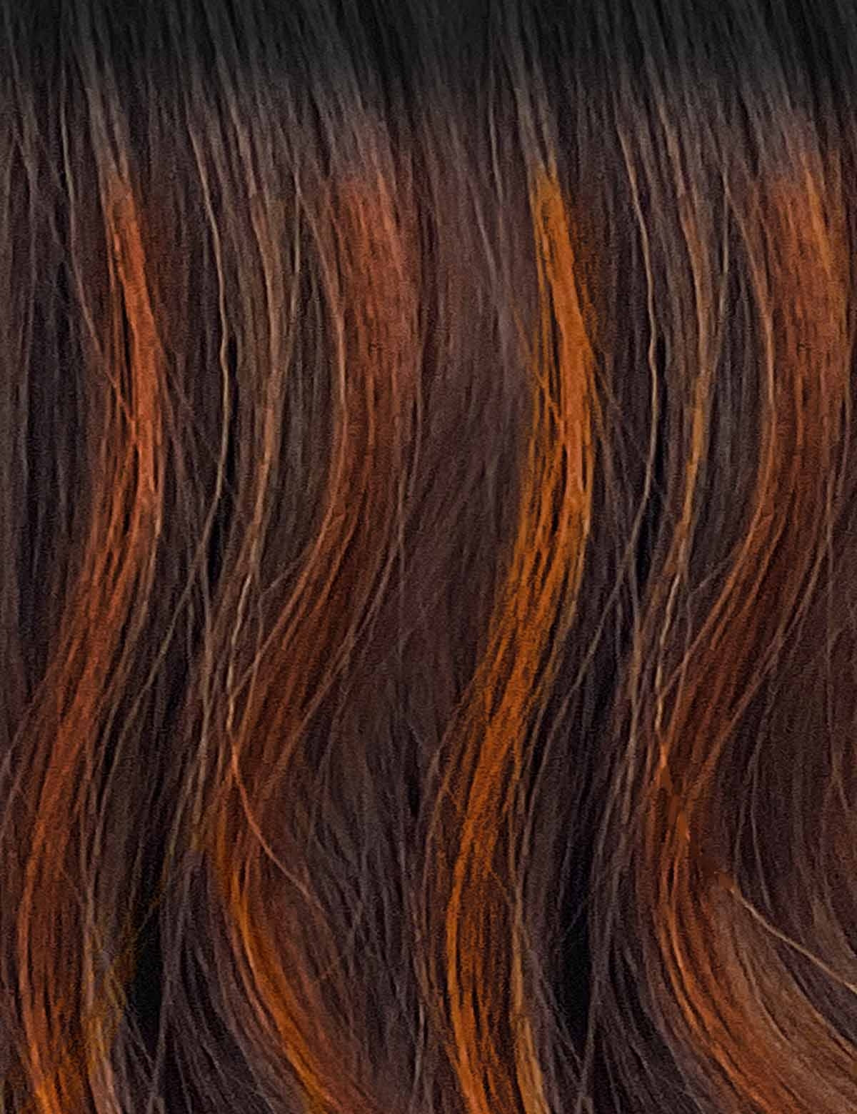 OUTRE synthetic curly half wig close up showing dark brown hair with auburn highlights and soft waves