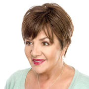 HAIR COUTURE short brown pixie wig on mature model showing natural volume and styling Remy human hair top piece