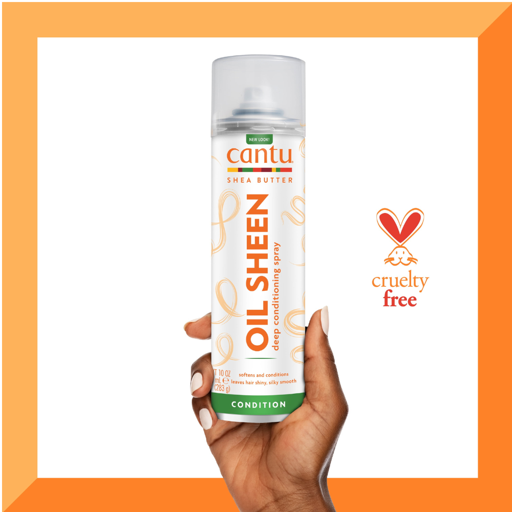 CANTU shea butter oil sheen spray can held in hand showing conditioning formula and cruelty free logo