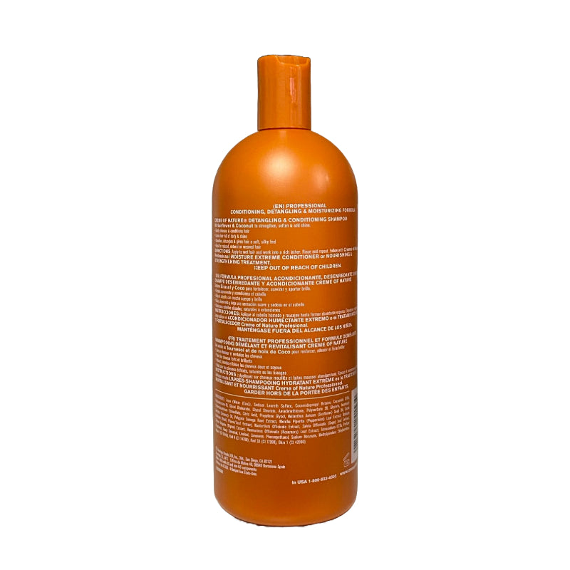 CREME OF NATURE orange bottle showing back label of detangling and conditioning shampoo for hair care