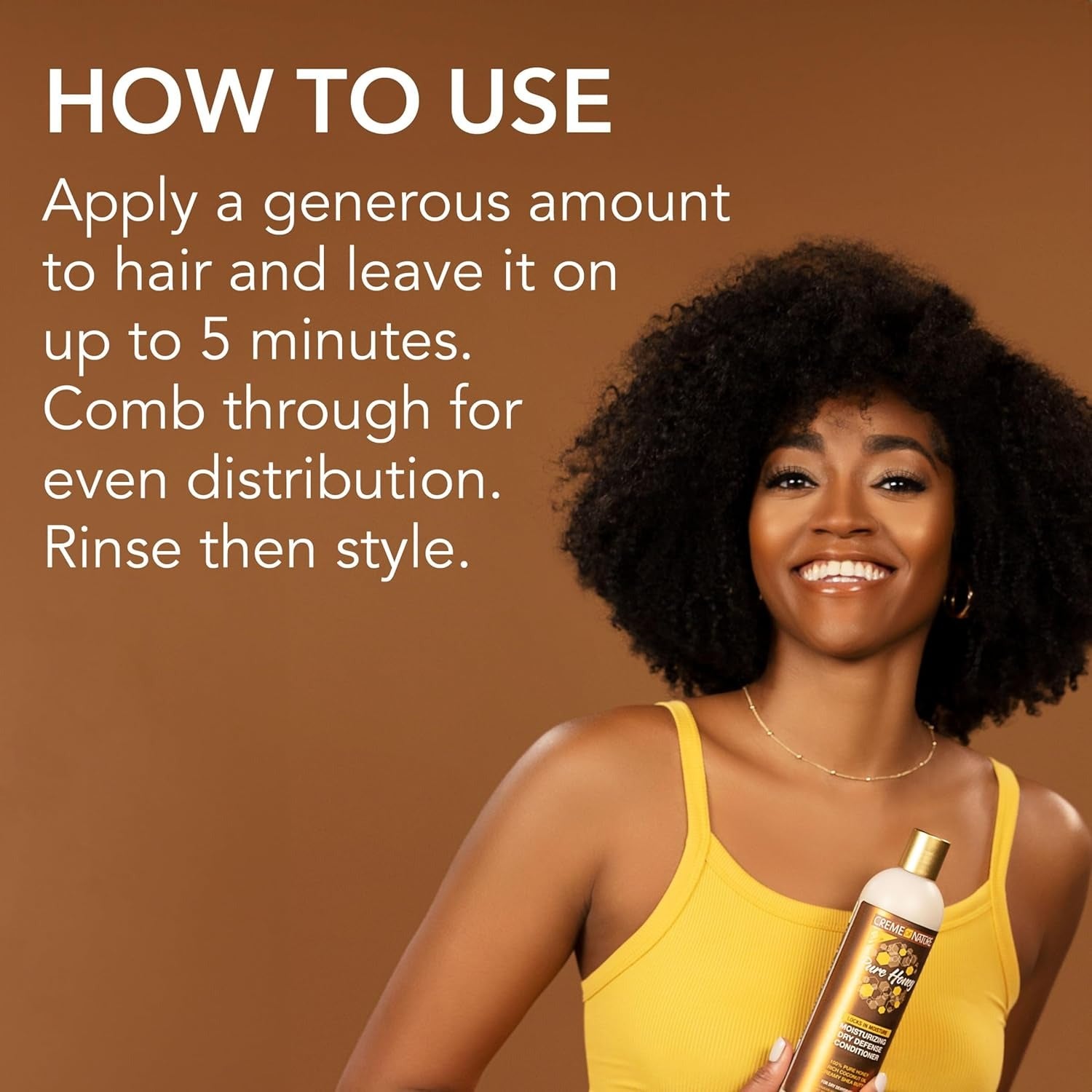 Smiling woman with natural afro holding CREME OF NATURE pure honey moisturizing conditioner with usage directions