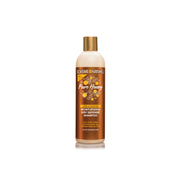 CREME OF NATURE pure honey moisturizing shampoo bottle with honeycomb label and gold cap for dry hair