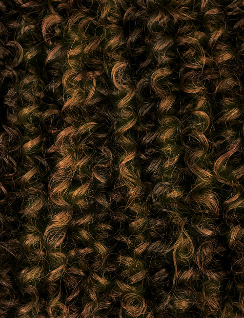 Close-up of OUTRE curly synthetic half wig with tight, natural-looking dark brown curls