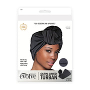 FIRSTLINE packaging showing black satin lined turban for natural hair worn by model with styling ties