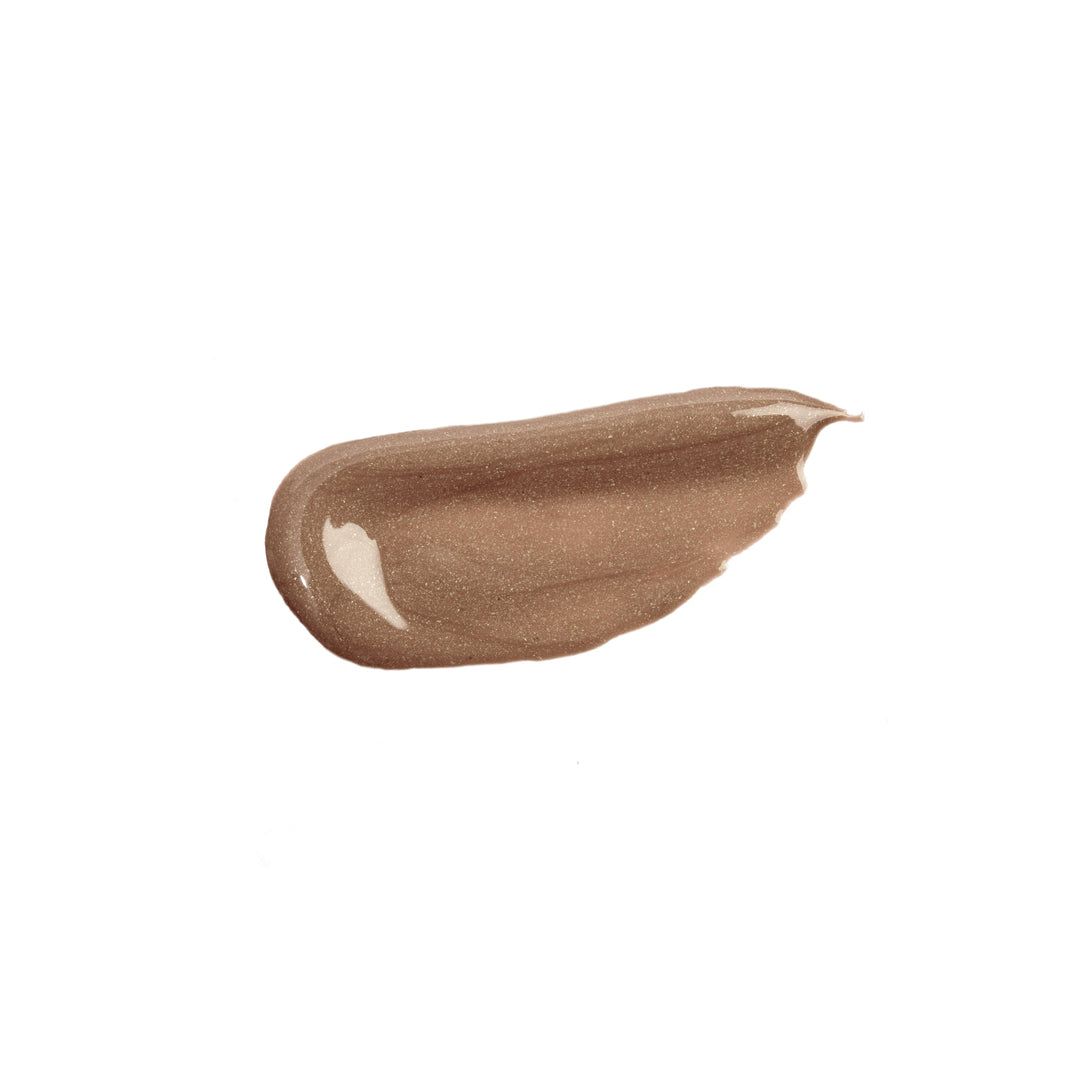 NICKA K liquid glow blush swatch in a shimmery bronze shade on white background