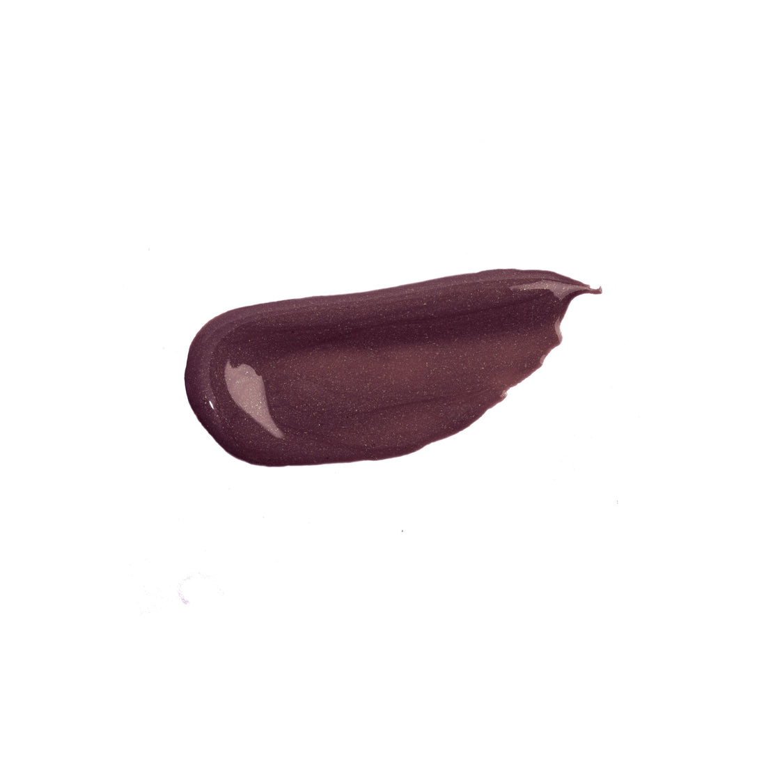 Nicka K liquid glow blush swatch in deep plum shade with shiny finish on white background