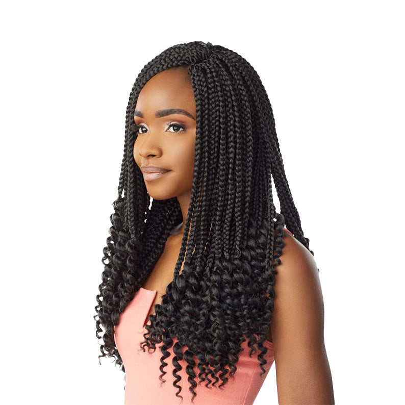 SENSATIONNEL goddess box braids 18 inch with curly ends styled on a woman in a pink top