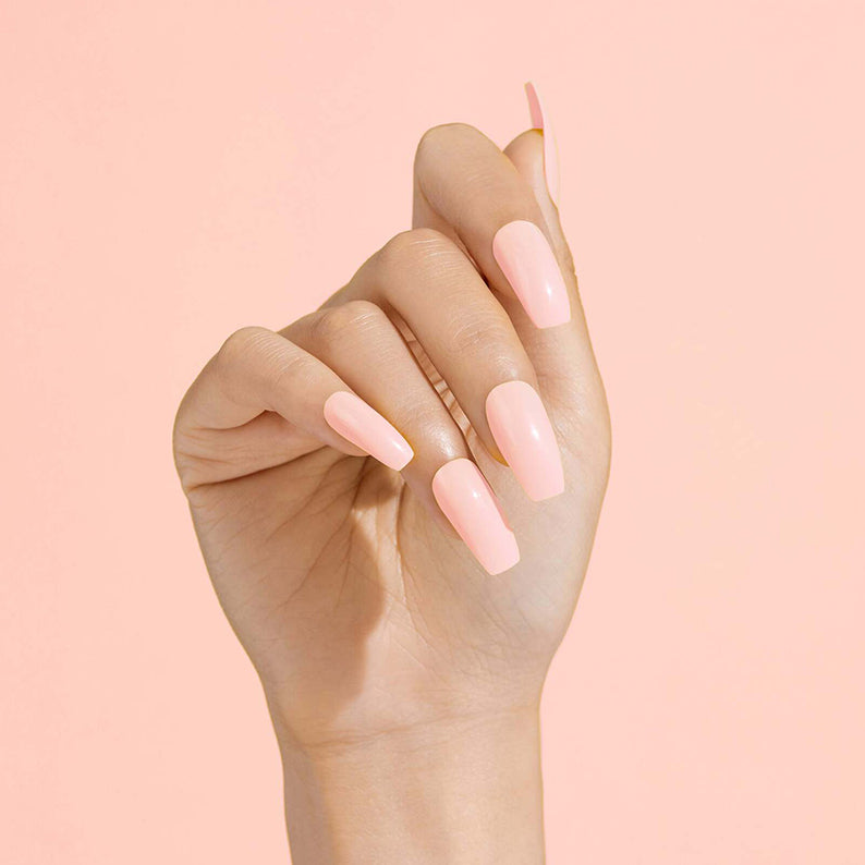 IVY BEAUTY by KISS long glossy coffin shape pale pink press on nails on model hand photo