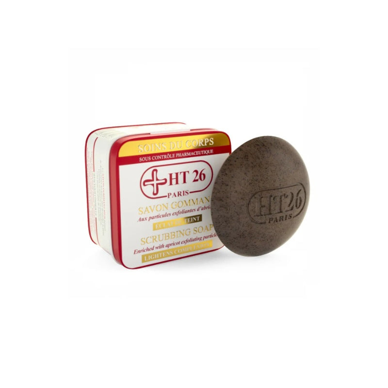 HT26 scrubbing soap round exfoliating brown bar embossed HT26 Paris beside white red tin box