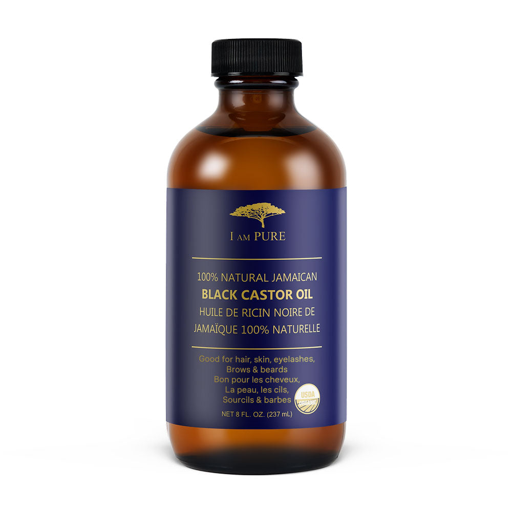 I AM PURE Jamaican black castor oil in amber bottle for hair skin and eyelash care