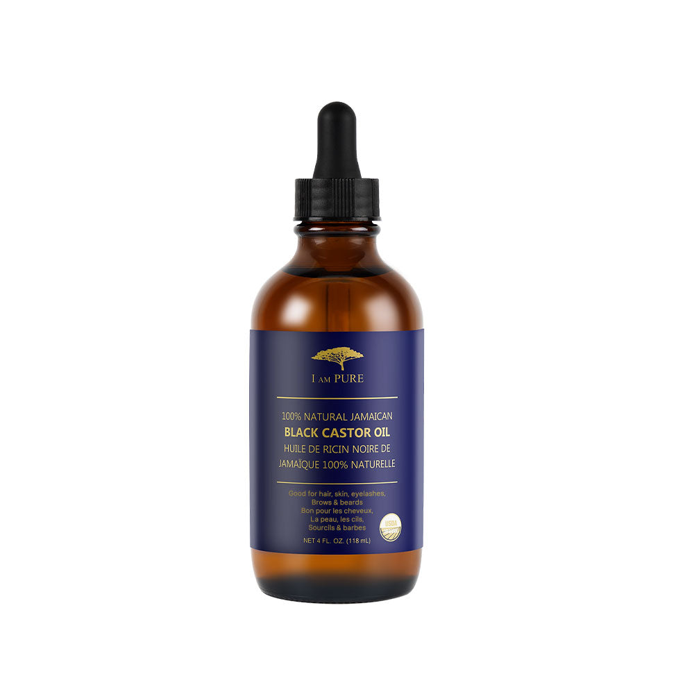 I AM PURE Jamaican black castor oil for hair growth in a brown dropper bottle with blue label