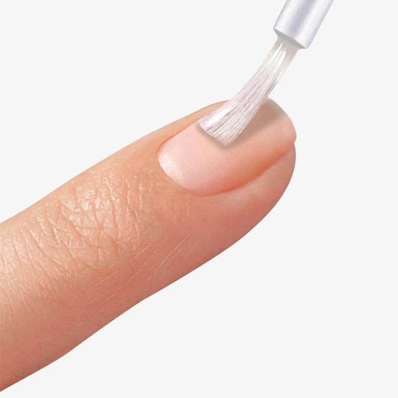 IVY BEAUTY by KISS applying clear dip base gel for nails to a natural fingernail with brush