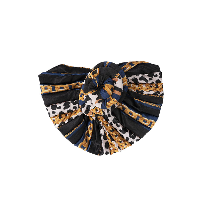 ANNIE silky top knot turban with black, white, blue, and gold chain print design
