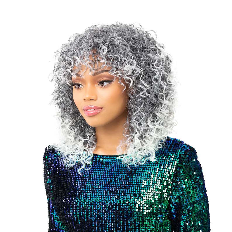 Model wearing Nutique synthetic full cap wig in silver gray ombre curly bob with fringe on a fashion model