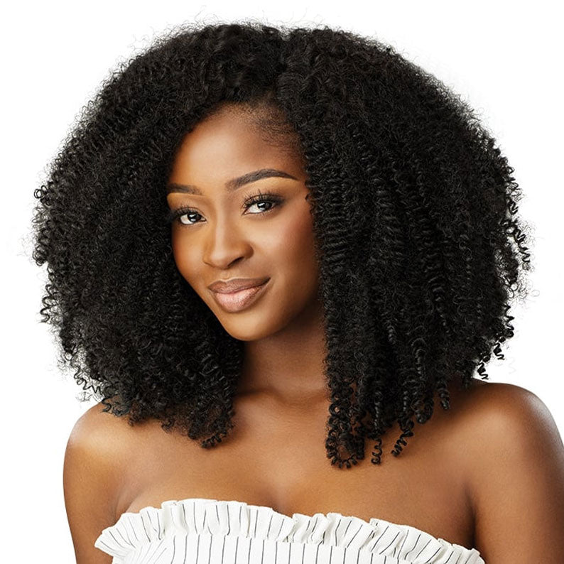 OUTRE afro clip in hair extensions shown on model with voluminous natural kinky curly black hair