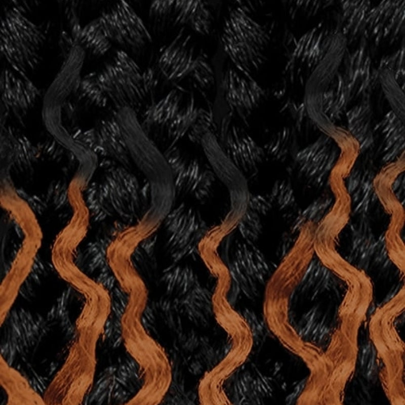 Outre boho island twist braiding hair featuring black twists with orange wavy accents for stylish braids