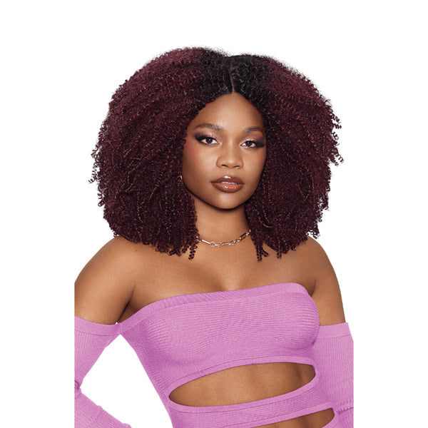 OUTRE Brazilian coily hair weave in burgundy shoulder length afro with middle part on model