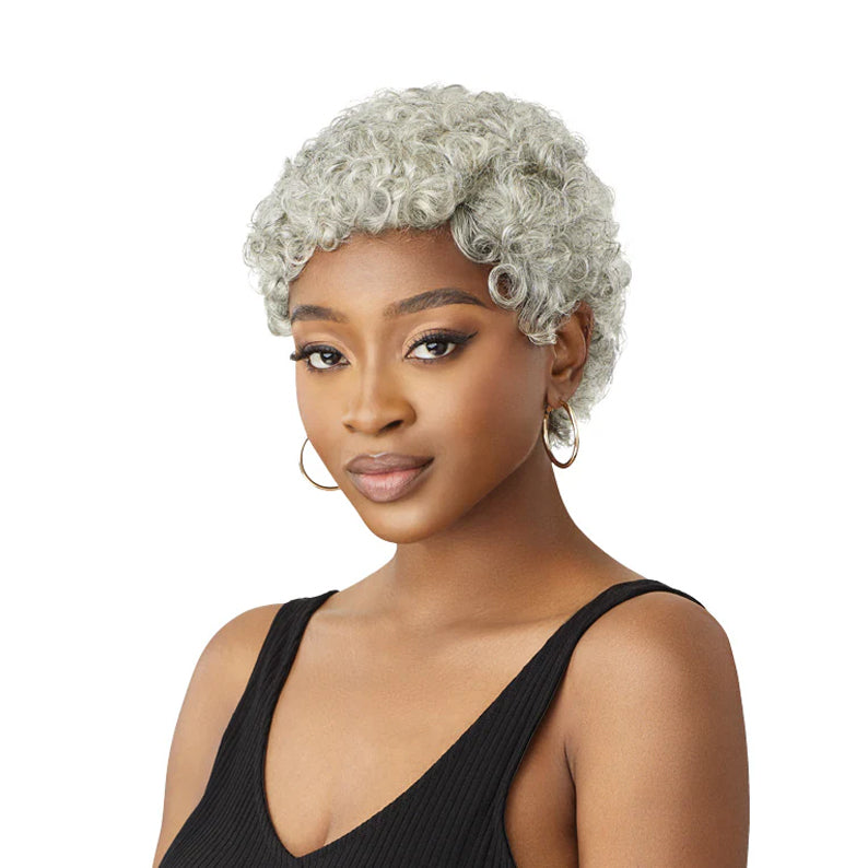 OUTRE gray human hair wig short curly pixie style on model with hoop earrings and black tank top