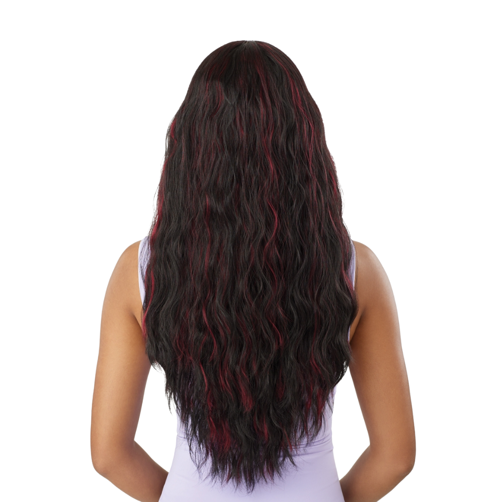 Back view of Outre The Daily Wig long wavy black wig with red highlights on a model wearing lavender top