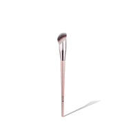 NICKA K angled concealer brush with angled soft synthetic bristles and rose gold handle for precise under eye coverage