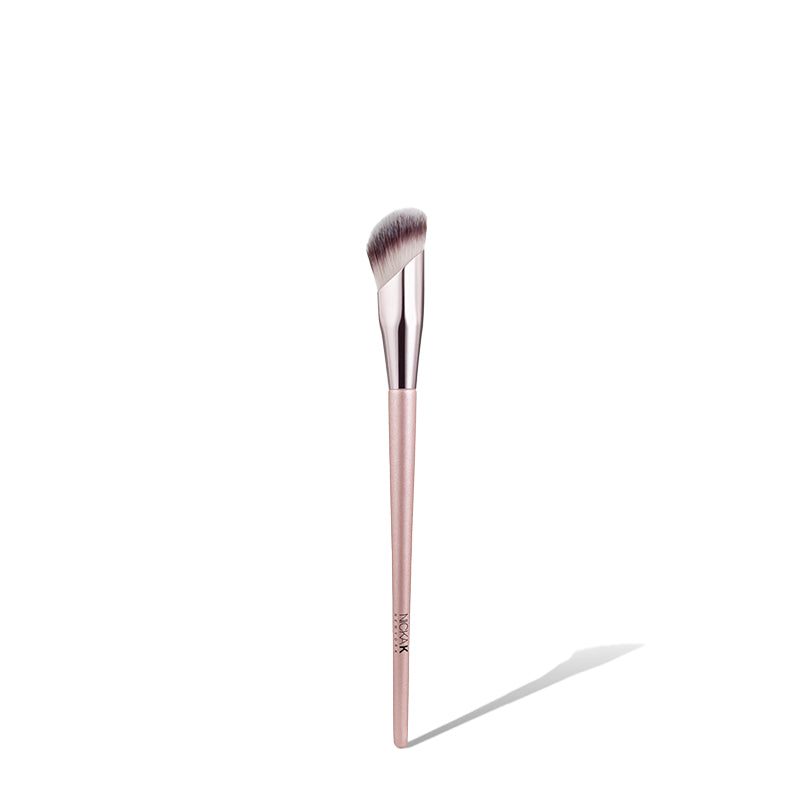 NICKA K angled concealer brush with angled soft synthetic bristles and rose gold handle for precise under eye coverage