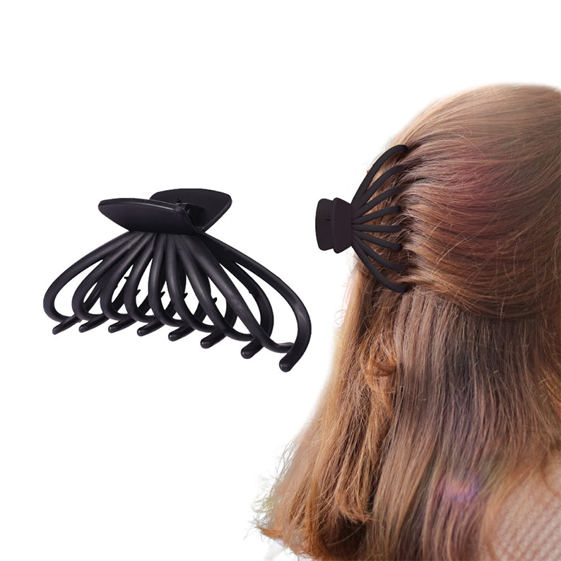 RED BEAUTY by KISS jumbo matte butterfly claw clip in black shown alone and securing half up hair