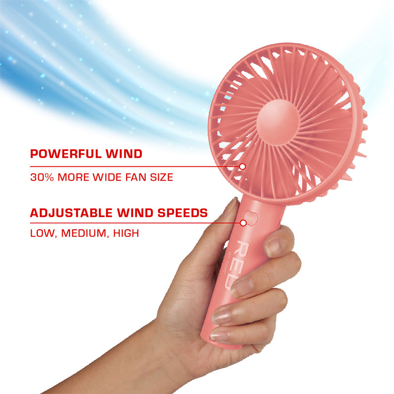 RED BEAUTY by KISS pink handheld portable beauty fan rechargeable with adjustable speeds shown in hand