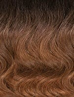 SENSATIONNEL Butta Lace Unit 11 wig close up showing soft wavy brown to caramel ombre hair and natural scalp part