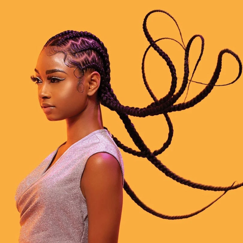 SENSATIONNEL pre-stretched braiding hair styled in long, sleek braids on a woman with a shiny top
