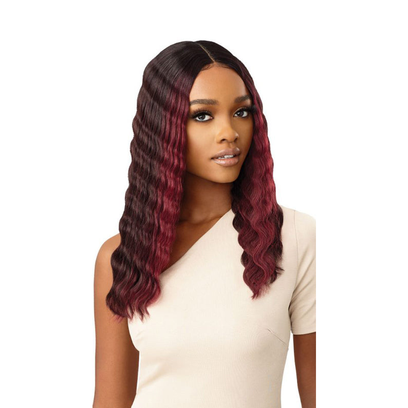 OUTRE 18 inch lace front wig with burgundy wavy hair on a woman wearing a beige top