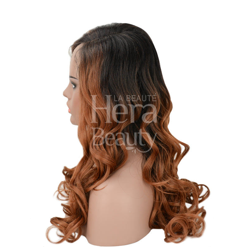 Side view mannequin wearing SENSATIONNEL Empress Shear Muse Kanesha lace front wig. Long wavy brown to copper ombre
