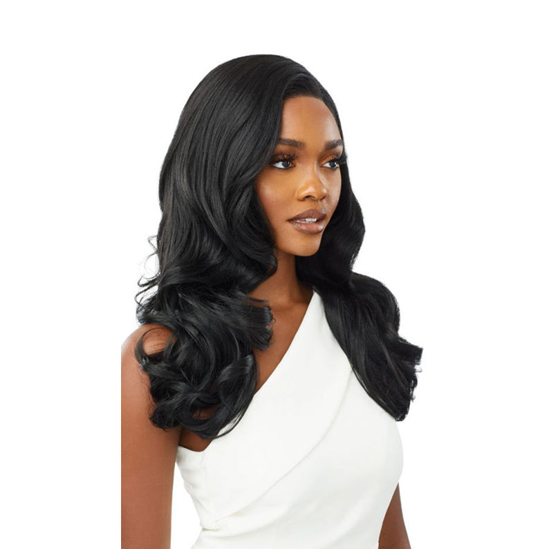 OUTRE long black wavy wig styled on model with side part and voluminous curls