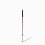 NICKA K angled eyeliner brush with rose gold handle and short dense angled bristles for precise liner