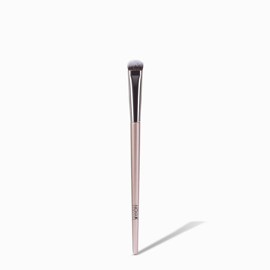 NICKA K flat dense eyeshadow brush with pink handle for precise eye makeup application