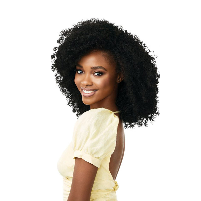 OUTRE synthetic curly half wig in natural black on smiling model with voluminous defined coils for easy styling