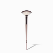 NICKA K mini fan makeup brush with soft fan bristles and slim pink handle for highlighting