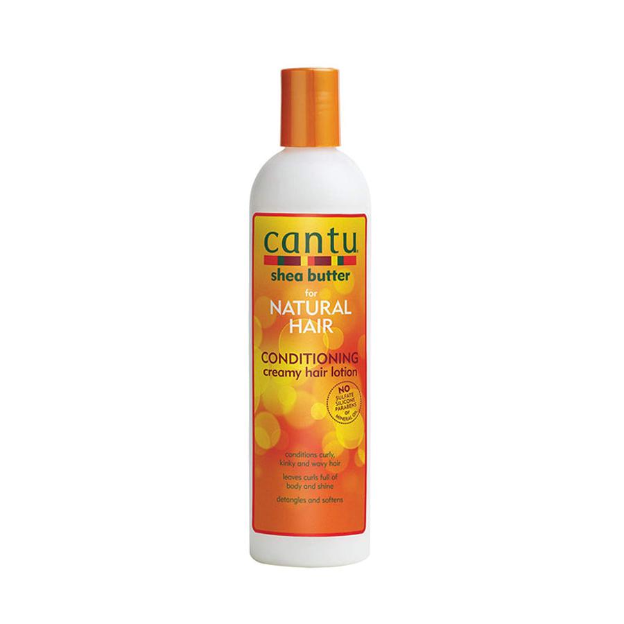 Cantu conditioning creamy hair lotion with shea butter for natural hair in white and orange bottle