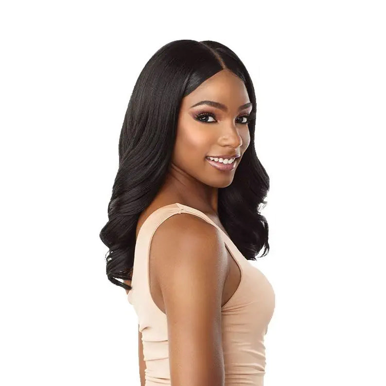 Model wearing SENSATIONNEL Cloud9 Whatlace HD Lace Wig Jalisa in natural black long wavy middle part for sleek everyday style