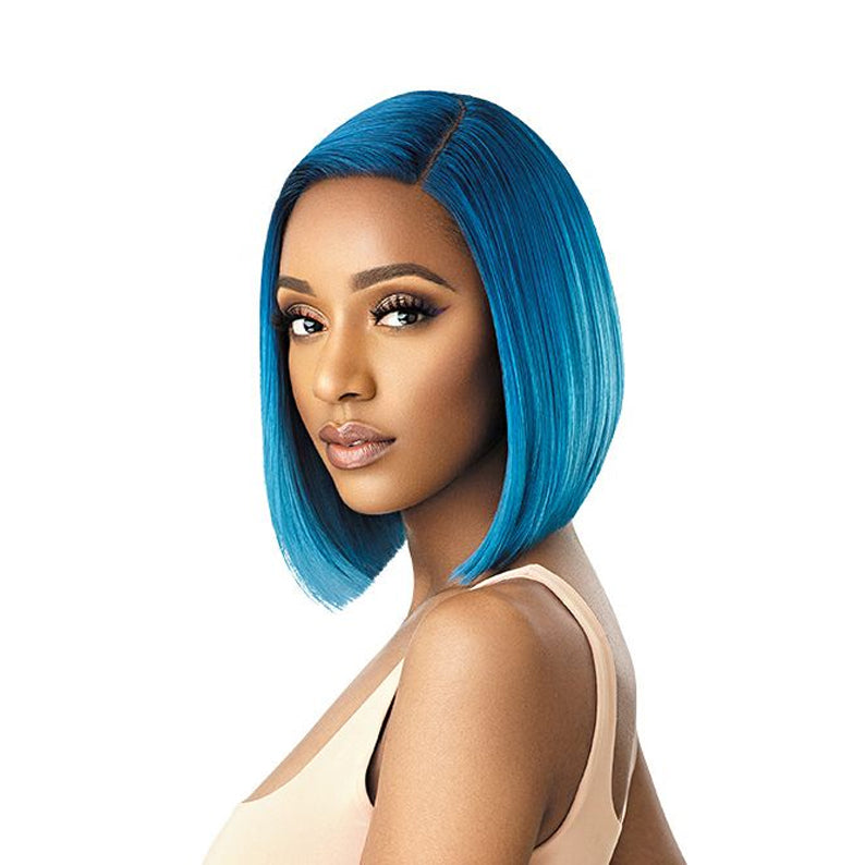 Model wearing OUTRE COLORBOMB synthetic lace front wig vibrant teal blue sleek chin length bob with side part