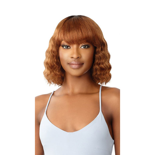 OUTRE Duby wig 100% human hair shoulder length auburn wavy bob with blunt bangs on model