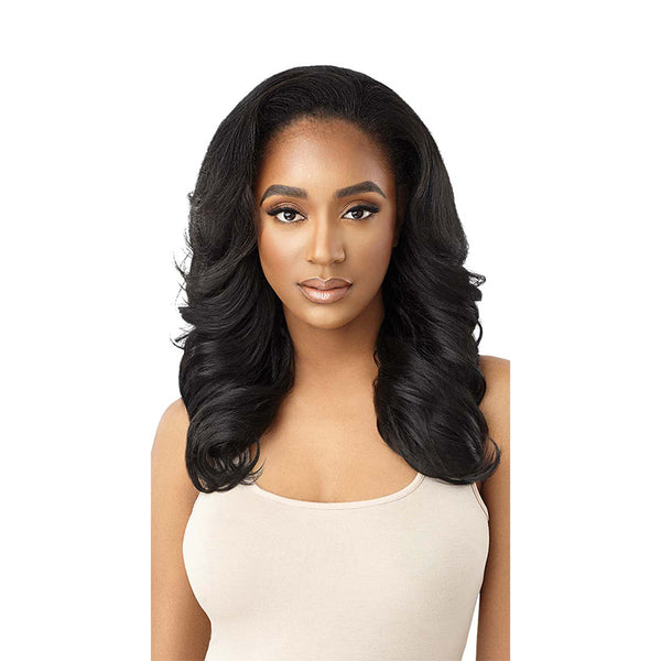 OUTRE black wavy quick weave half wig on model with long voluminous layers for natural everyday style