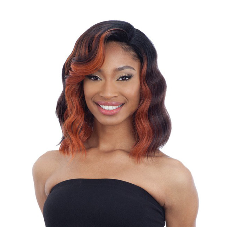SHAKE N GO model wearing Freetress Equal 5 inch lace part wig shoulder length wavy bob with copper highlights