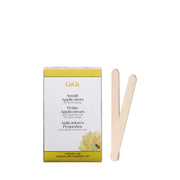 GIGI small waxing applicator sticks wooden spatulas next to box for facial and body waxing