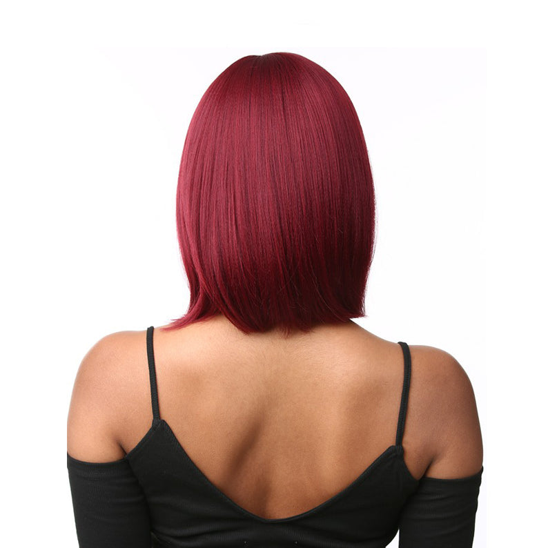 SENSATIONNEL synthetic bob wig with bangs in rich burgundy straight shoulder length style on model back view