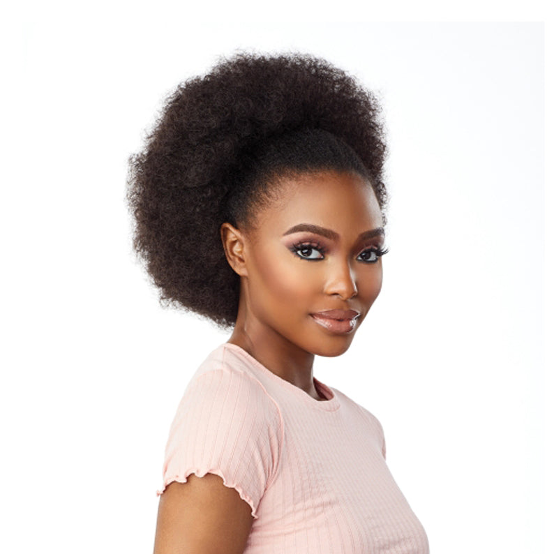 Sensationnel instant weave synthetic half wig in natural afro puff style on model wearing pink top