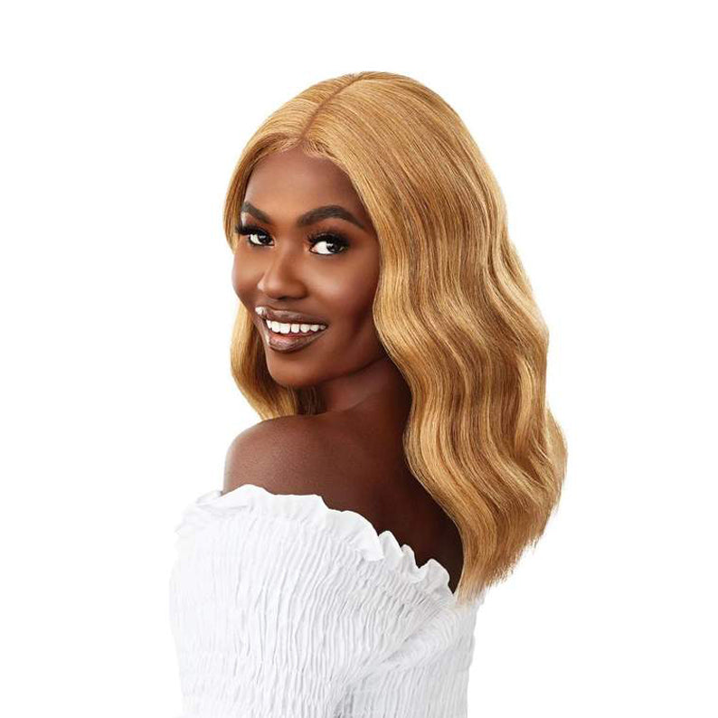 OUTRE 16 inch lace front wig in blonde with soft waves styled on a smiling model