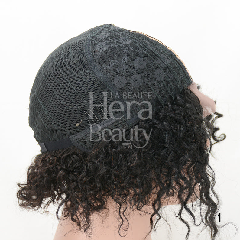 ITS A WIG human hair T-part wig showing black lace cap construction and short curly black hair